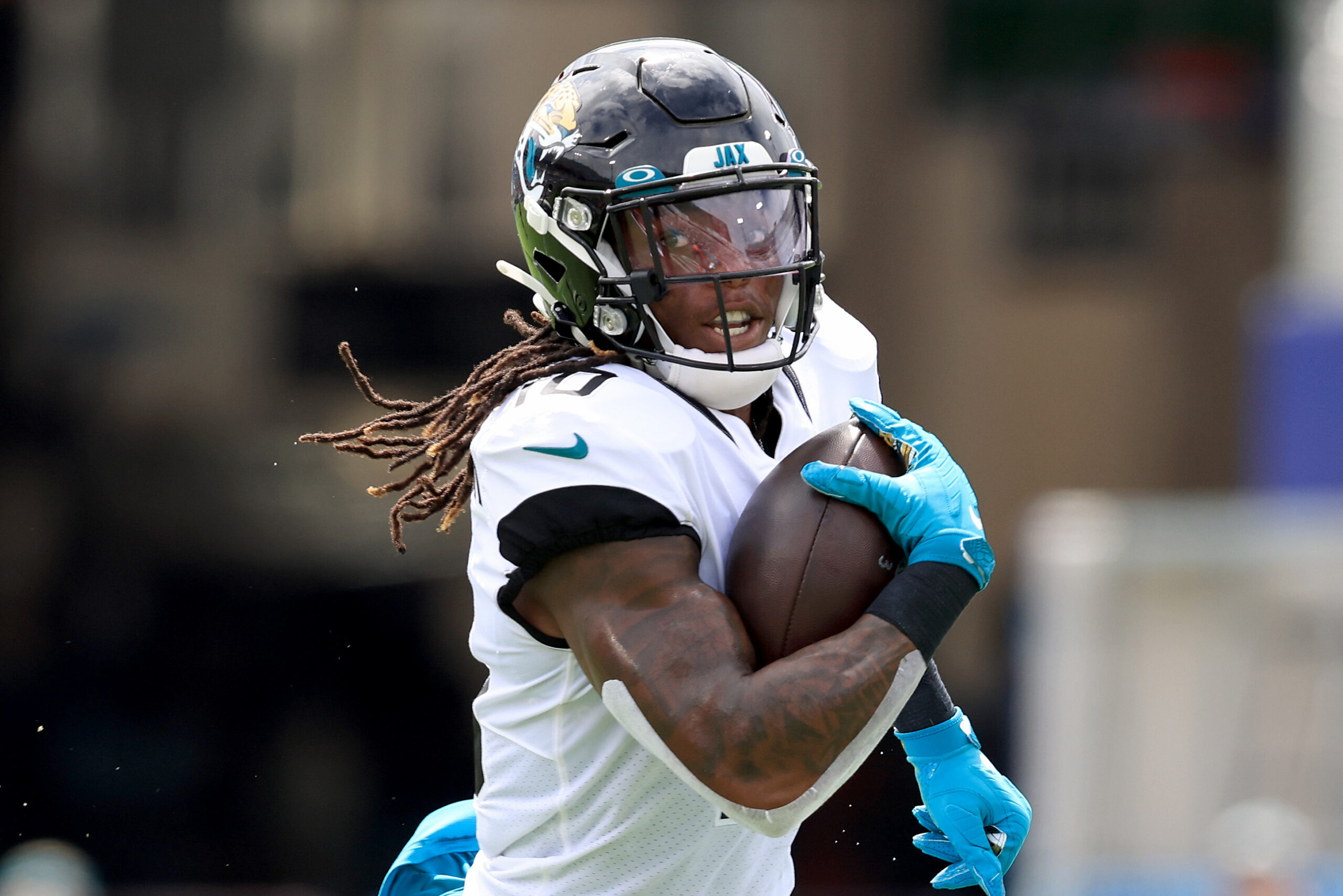 Laviska Shenault Jr. #10 of the Jacksonville Jaguars runs for yardage during the game against the Denver Broncos at TIAA Bank Field on September 19, 2021 in Jacksonville, Florida.