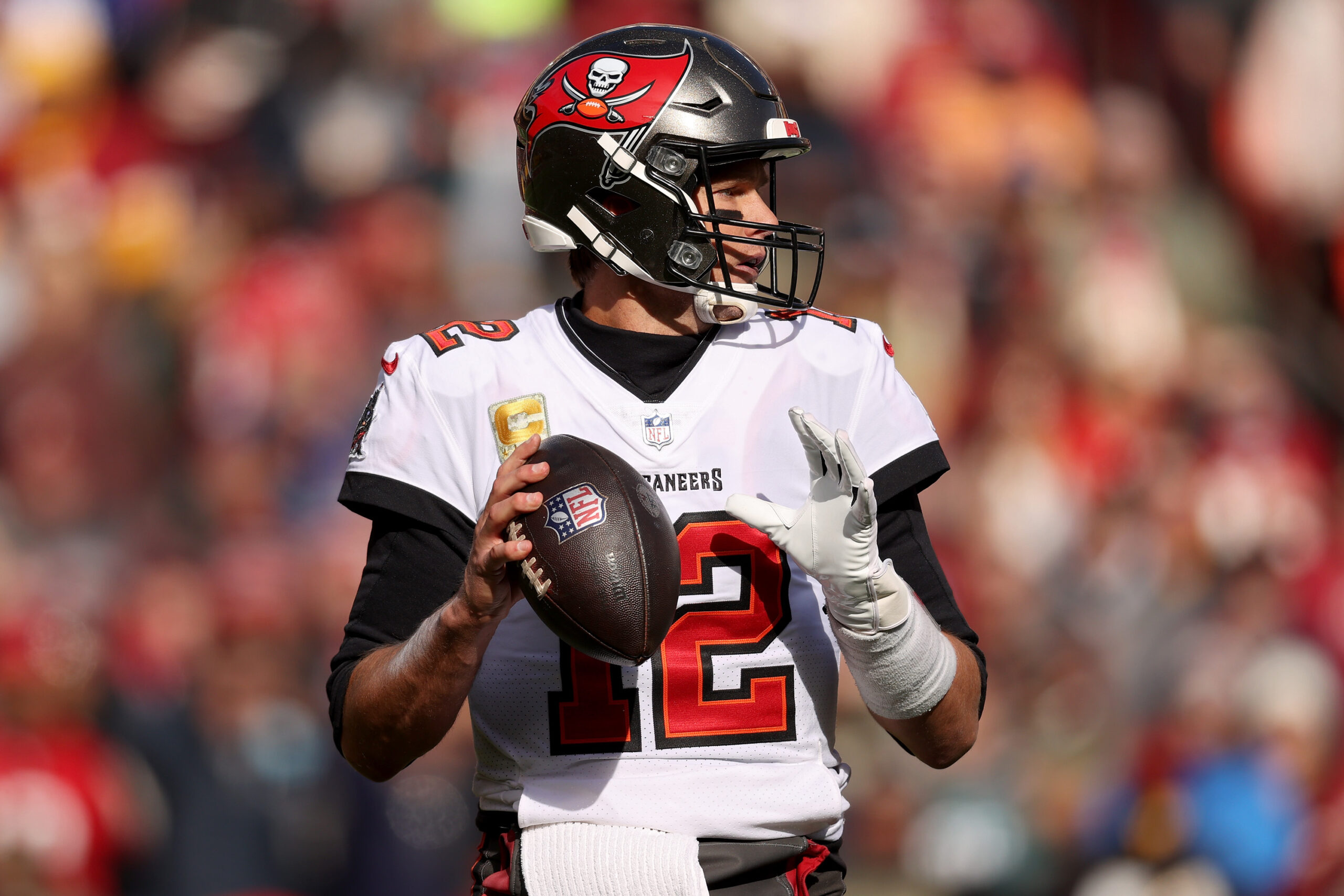 Tom Brady #12 of the Tampa Bay Buccaneers throws the ball during the first half against the Washington Football Team at FedExField on November 14, 2021 in Landover, Maryland.