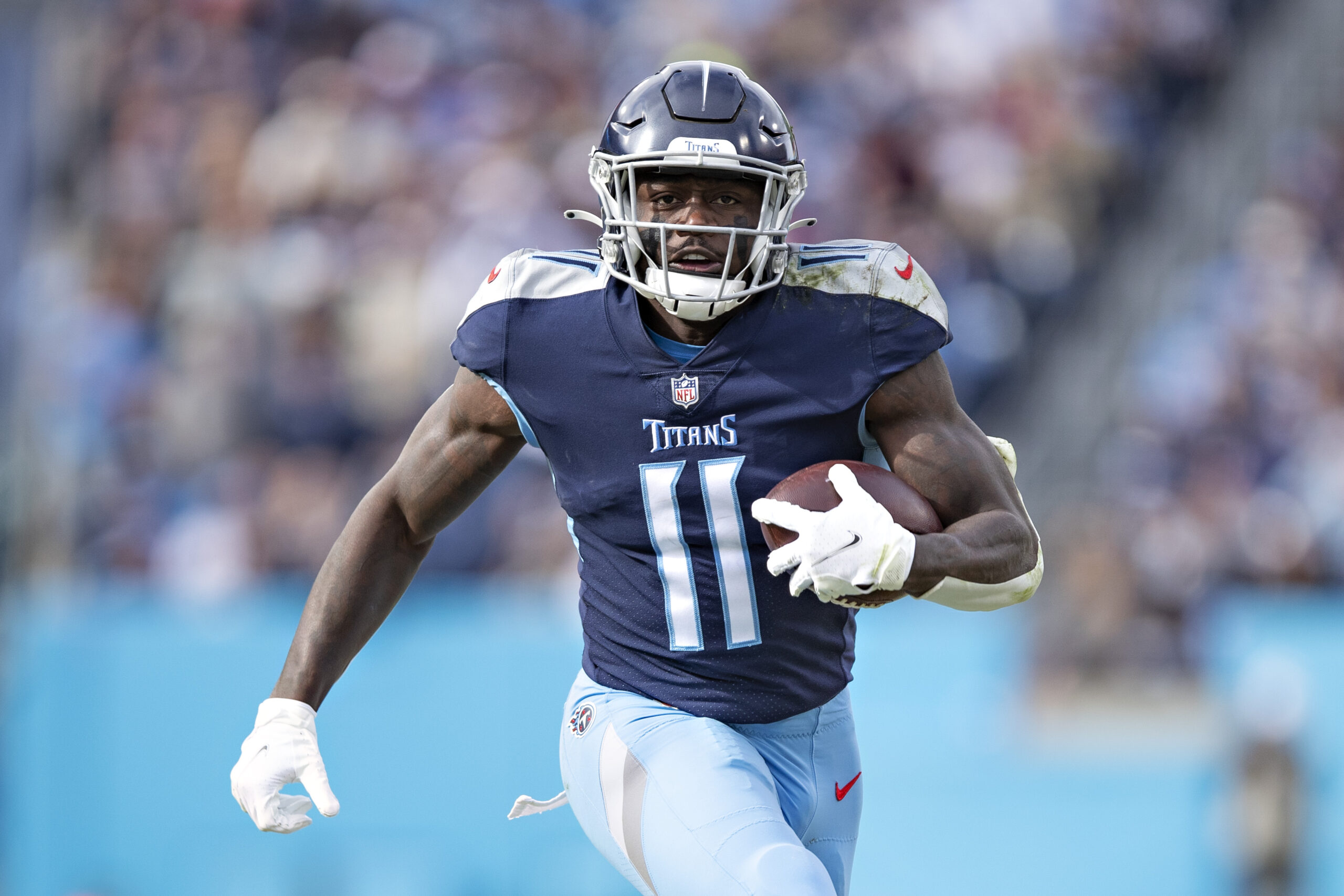 A.J. Brown #11 of the Tennessee Titans runs the ball during a game against the New Orleans Saints at Nissan Stadium on November 14, 2021 in Nashville, Tennessee. The Titans defeated the Saints 23-21.