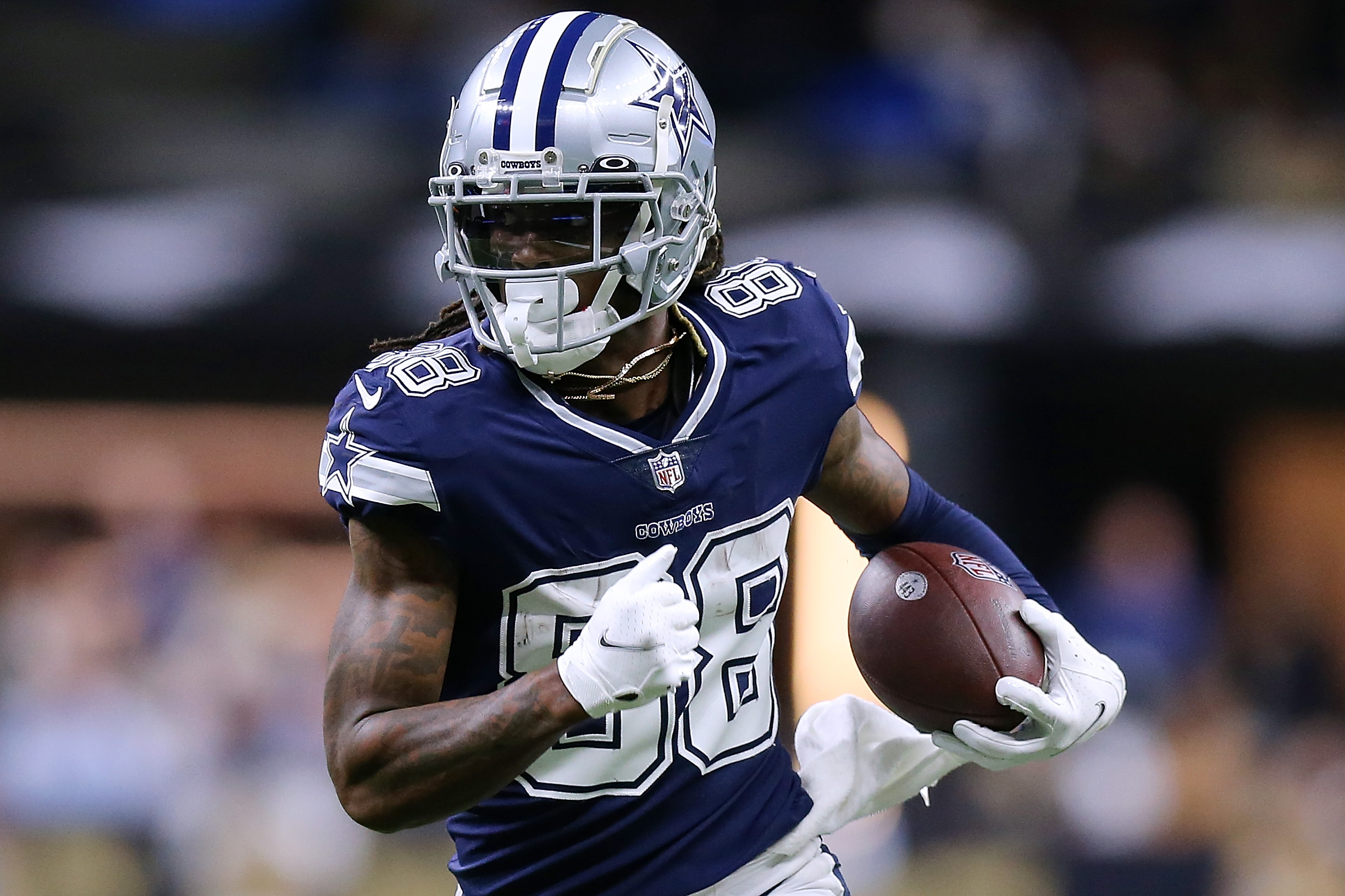 CeeDee Lamb #88 of the Dallas Cowboys runs with the ball against the New Orleans Saints during a game at the the Caesars Superdome on December 02, 2021 in New Orleans, Louisiana.