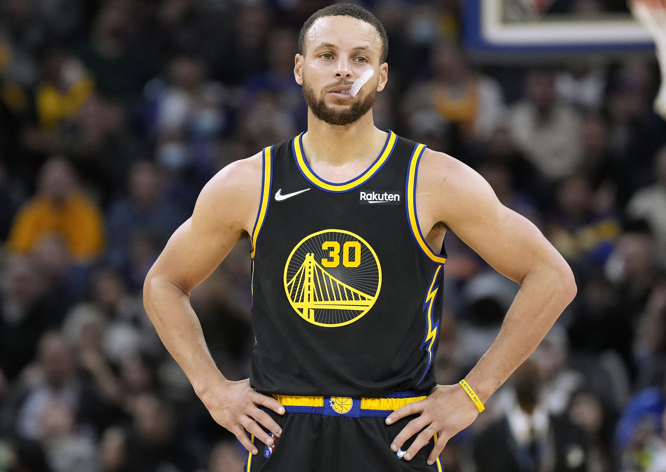 Stephen Curry #30 of the Golden State Warriors looks on against the Denver Nuggets during the second half of an NBA basketball game at Chase Center on February 16, 2022 in San Francisco, California.