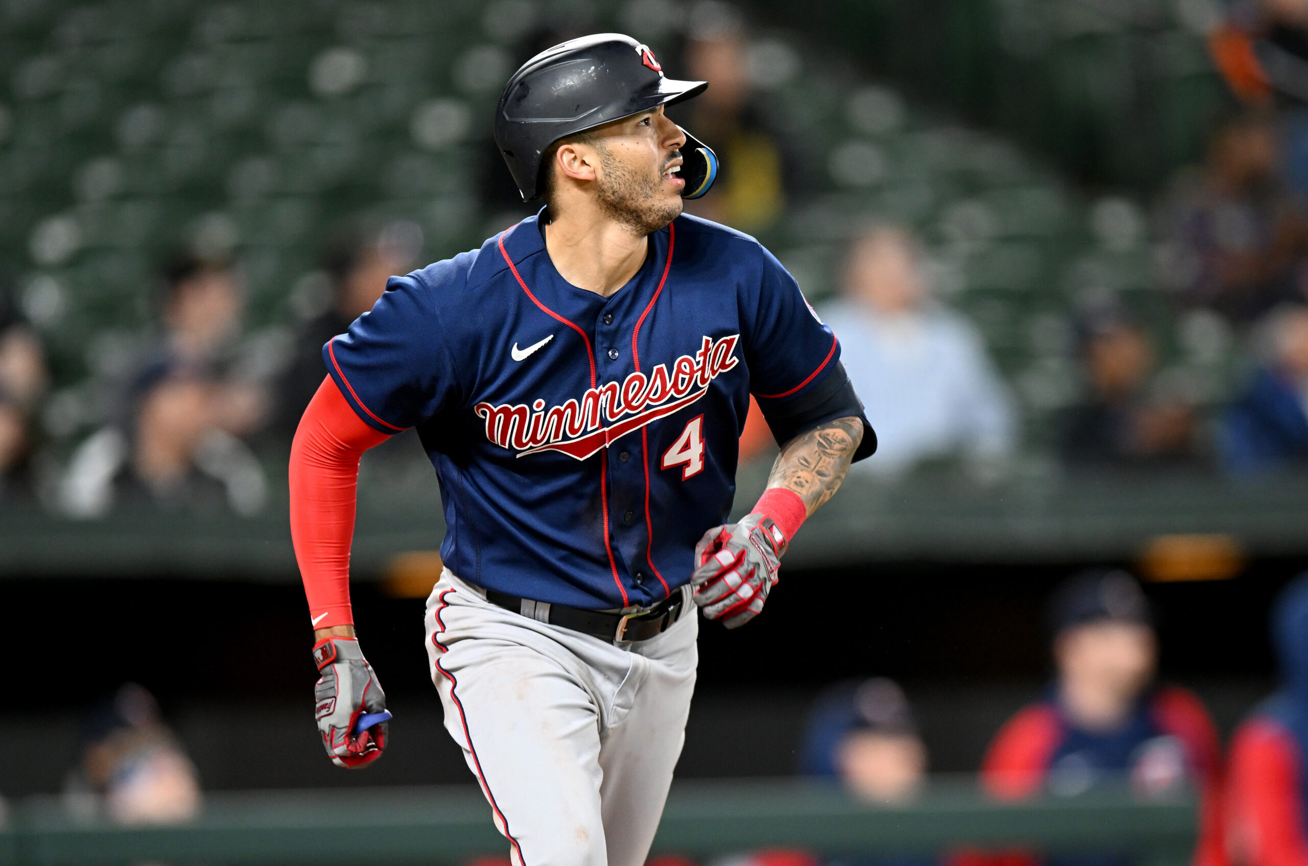 Carlos Correa #4 of the Minnesota Twins runs to first base against the Baltimore Orioles at Oriole Park at Camden Yards on May 03, 2022 in Baltimore, Maryland.
